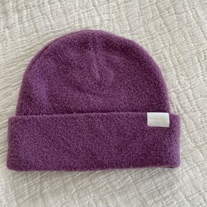Women’s The North Face beanie/toboggan in purple/mauve/grape color.